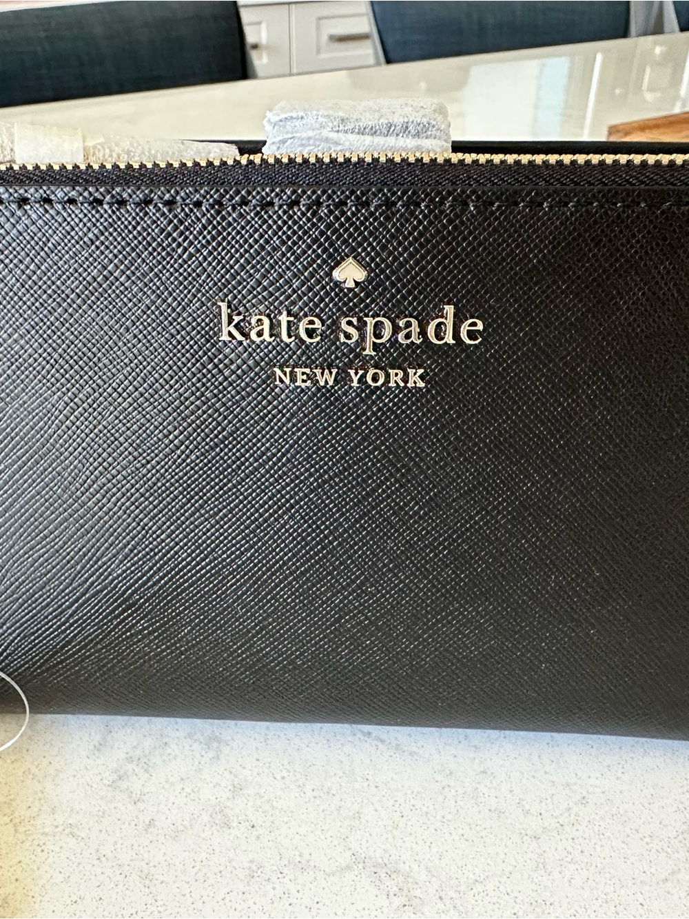 kate spade black Saffiano leather wristlet clutch with gold logo
